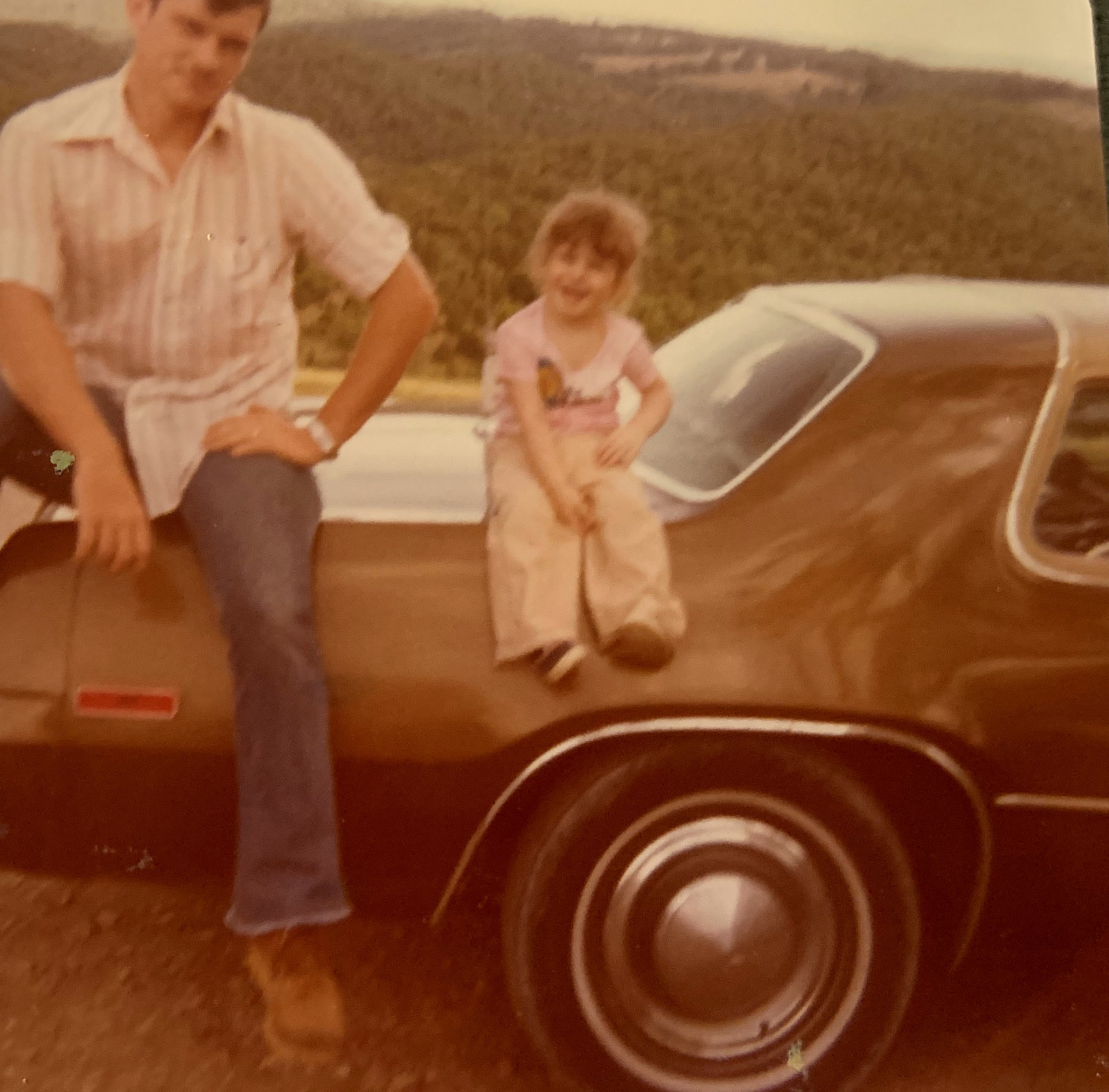 Holly's dad and Holly with his 1977 Plymouth in Branson, Missouri